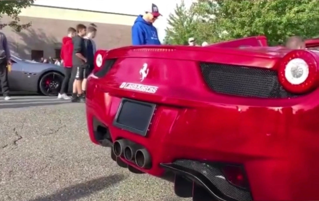 Red Ferrari 458 with Stealth Plate. License plate cover by 510 Auto Group